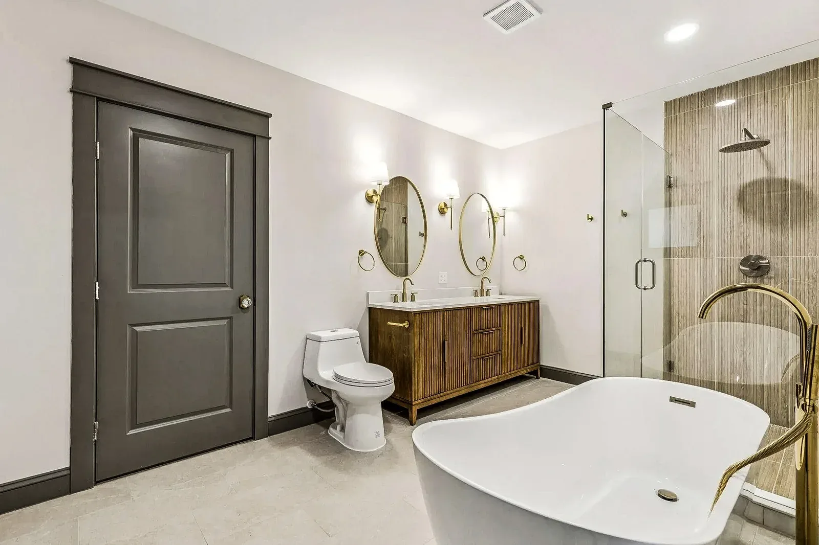 Dallas primary bathroom suite addition with double vanity and glass shower