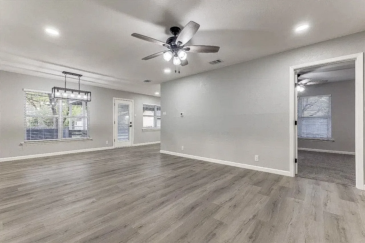 Open living and dining areas connected through a whole-home renovation
