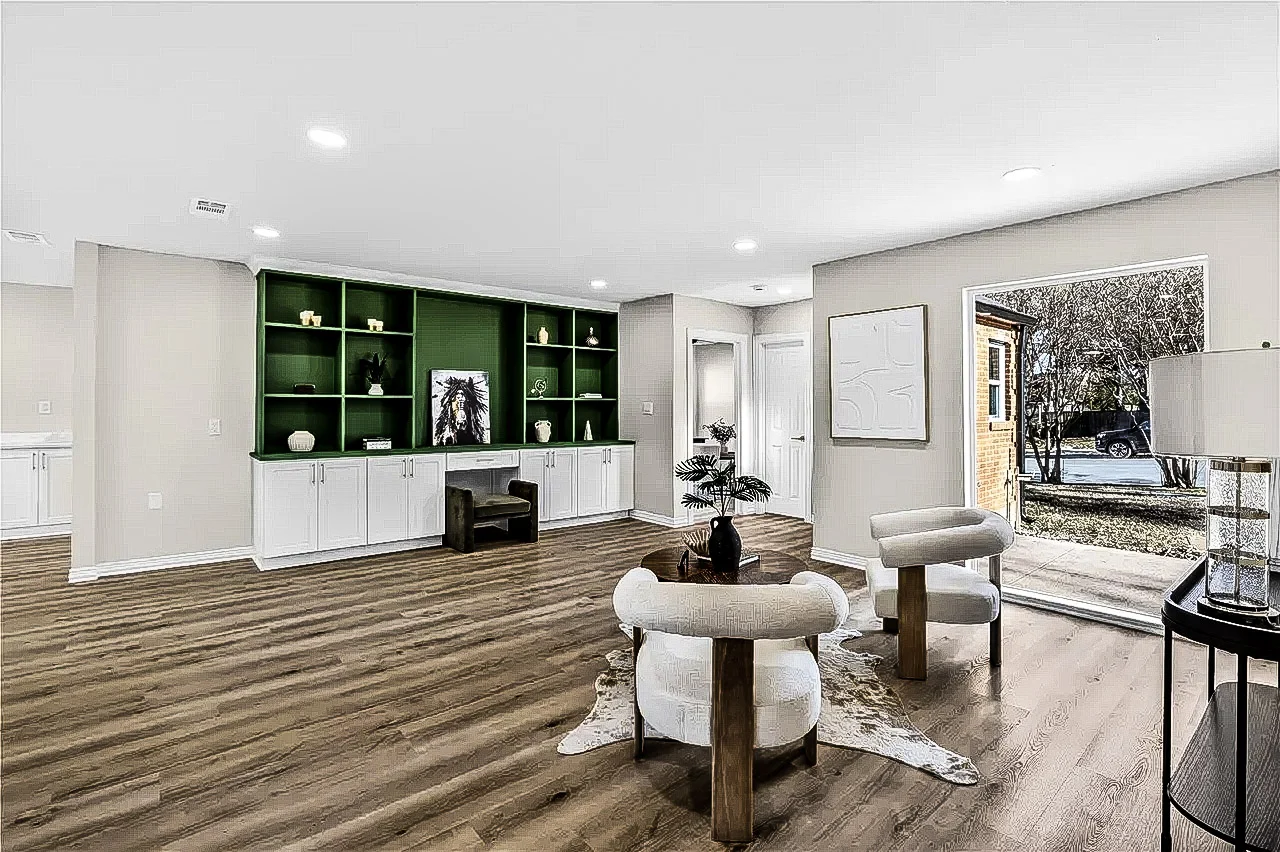 Living room with deep green custom built-ins, white lower cabinets, light wood-look flooring, and broad windows in Lakewood, Dallas, Texas.