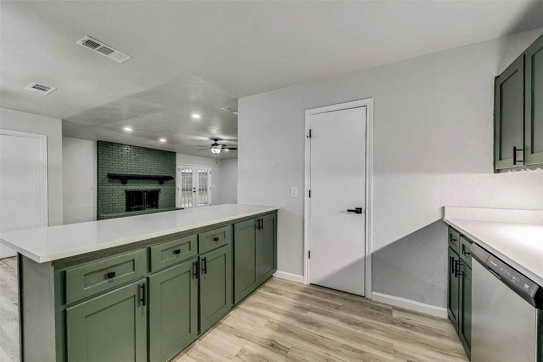 Open-concept renovation after load-bearing wall removal completed by Utmost Builds in Plano, Texas