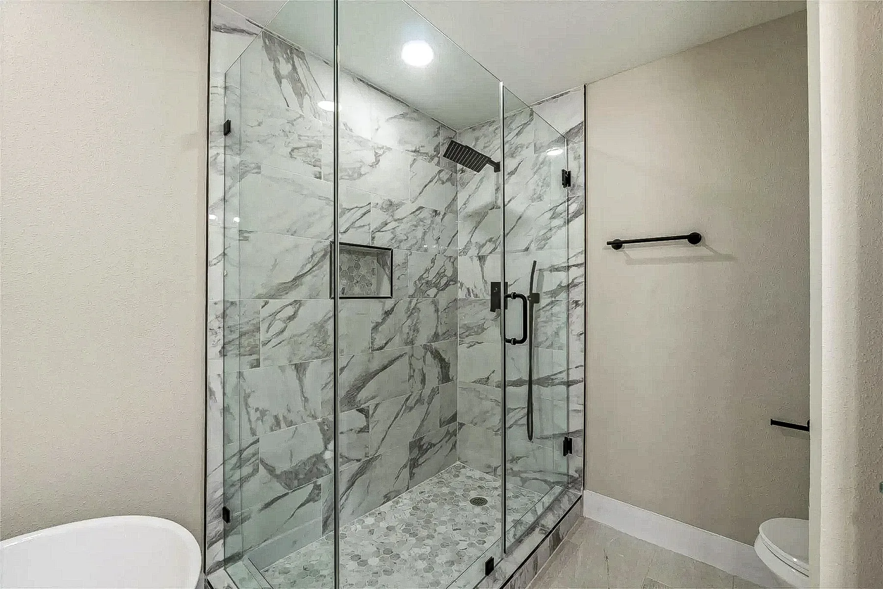 Primary bathroom shower remodel completed by Utmost Builds in Fort Worth, Texas