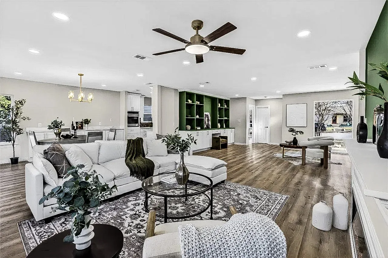 Open Lakewood living area with green custom built-ins, white base cabinets, wood-look flooring, and staged seating.